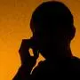 Communication - silhouette of man speak over the phone (back light)
