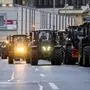 Farmers with tractors stand on a street in the centre of the Czech capital during a demonstration to draw attention to the poor situation of Czech agriculture in Prague, Monday, Feb. 19, 2024.  Some Czech farmers rallied in the capital on Monday to protest the European Union policies on in agriculture and unfair conditions for doing their business. Hundreds of tractors and other vehicles blocked one line on a major road in downtown Prague but traffic was not halted. Anticipating a possible collapse of traffic, City Hall warned people not to drive to Prague on Monday. (Ondrej Deml/CTK via AP)