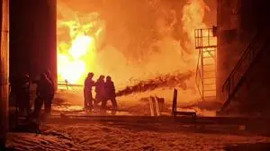 TOPSHOT - This grab from a handout footage published on the official Telegram account of the governor of the Kursk region Roman Starovoit on February 15, 2024, shows firefighters working to extinguish a fire at an oil depot in the Kursk region. A night-time Ukrainian drone attack set ablaze a Russian oil depot in the Kursk region near the frontier between the two countries, Russian authorities said on February 15, 2024. (Photo by Handout / TELEGRAM / @gubernator_46 / AFP) / RESTRICTED TO EDITORIAL USE - MANDATORY CREDIT "AFP PHOTO / Telegram account @gubernator_46" - NO MARKETING NO ADVERTISING CAMPAIGNS - DISTRIBUTED AS A SERVICE TO CLIENTS