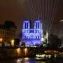 This photograph taken on December 5, 2024 shows the Notre-Dame de Paris cathedral illuminated along the Seine river, in Paris, a few days before its reopening on December 7, 2024. (Photo by Ludovic MARIN / AFP)