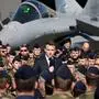 France's President Emmanuel Macron (C) delivers a speech in front of a Dassault Rafale fighter aircraft during his visit of the French Air and Space Force (Armee de l'air et de l'espace) Luxeuil-Saint-Sauveur Airbase in Saint-Sauveur, north-eastern France on March 18, 2025. (Photo by Ludovic MARIN / POOL / AFP)
