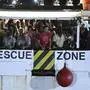 The Open Arms rescue ship arrives on the Sicilian island of Lampedusa, southern Italy, Tuesday, Aug. 20, 2019. Italian prosecutor Luigi Patronaggio has ordered the seizure of a migrant rescue ship and the immediate evacuation of more than 80 migrants remaining on board, capping dramatic developments that saw 15 migrants jump into the sea in a desperate bid to reach land and the Spanish government dispatch a Naval ship on a long journey to resolve the escalating crisis. (AP Photo/Salvatore Cavalli)
