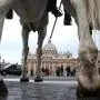 Horses, ridden by Carabinieri - Italian paramilitary police officers,  stand at  the entrances of  St. Peter's Square at the Vatican prior of the Easter Mass celebrated by Pope John Paul II, Sunday, April 11, 2004. Italy stepped up security around the Vatican and other sites over the Easter holidays.  (AP Photo/Pier Paolo Cito)