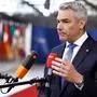Austria's Federal Chancellor Karl Nehammer addresses the press during the European Council summit at the EU headquarters in Brussels, on April 18, 2024. (Photo by KENZO TRIBOUILLARD / AFP)