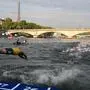 (FILES) Triathlon athlete dives in the Seine river with The Eiffel Tower in the background during the men's 2023 World Triathlon Olympic Games Test Event in Paris, on August 18, 2023. From August 17 to 20, 2023, Paris 2024 is organising four triathlon events to test several arrangements, such as the sports operations, one year before the Paris 2024 Olympic and Paralympic Games. The swim familiarisation event follows the cancellation on August 6 of the pre-Olympics test swimming competition due to excessive pollution which forced organisers to cancel the pre-Olympics event. (Photo by Bertrand GUAY / AFP)