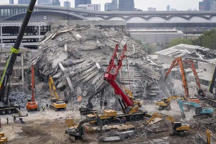 April 2, 2025, Bangkok, Bangkok, Thailand: Heavy machinery is used to clear away wreckage from the State Audit Office construction site collapse in Bangkok, Thailand caused by the March 28th 7.7 earthquake in neighboring Myanmar. The under construction government high rise stood at 33 stories tall when the earthquake struck while the workers were on their lunch break, causing it to implode downward with violent force. Official numbers list 15 dead and 9 injured recovered from the site with 72 still unaccounted for. Bangkok Thailand - ZUMAt128 20250402_zap_t128_003 Copyright: xAdryelxTalamantesx