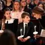 From right, Britain's Kate, Princess of Wales, Prince Louis and Princess Charlotte attend the Together At Christmas carol service at Westminster Abbey in London, Friday Dec. 5, 2025. (Aaron Chown/PA via AP, Pool)