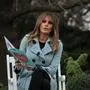(FILES) US First Lady Melania Trump reads a book to children during the annual Easter Egg Roll at the White House in Washington, DC, on April 2, 2018. While her husband is busy on the campaign trail in the final weeks of the presidential race, Melania Trump is involved in a different kind of campaign: promoting her forthcoming book. (Photo by NICHOLAS KAMM / AFP)
