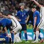 Players call for medical attention after a collision between Italy's midfielder Jorginho (L) and England's midfielder Jack Grealish (R) during the UEFA EURO 2020 final football match between Italy and England at the Wembley Stadium in London on July 11, 2021. (Photo by Andy Rain / POOL / AFP)