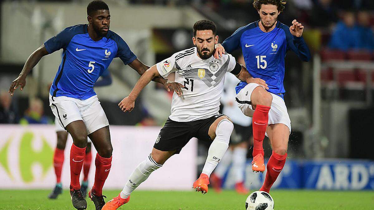 Samuel Umtiti (FRA), Ilkay Guendogan (GER) und Adrien Rabiot (FRA)