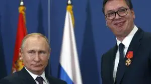 FILE- Russian President Vladimir Putin, left, poses with Serbian President Aleksandar Vucic after being awarded the Order of Alexander Nevsky in Belgrade, Serbia, on Jan. 17, 2019. The populist leader has ruled the Balkan nation for more than a decade as both prime minister and president. After his populists won a weekend snap parliamentary election, Vucic seems set to tighten his already autocratic rule still further. (AP Photo/Darko Vojinovic, File)