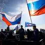 RUSSIA, DONETSK - OCTOBER 7, 2024: Members of United Russia s Young Guard wave national flags during a car rally marking President Vladimir Putin s 72nd birthday. Dmitry Yagodkin/TASS PUBLICATIONxINxGERxAUTxONLY 74782244