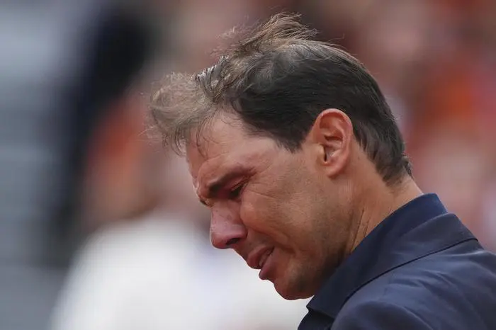 Rafa Nadal gets emotional during a farewell ceremony at center court Philippe-Chatrier, at the Roland-Garros stadium, in Paris, Sunday May 25, 2025. (AP Photo/Lindsey Wasson)