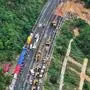 240501 -- MEIZHOU, May 1, 2024 -- An aerial drone photo taken on May 1, 2024 shows rescuers working at the site of a road cave-in on a section of the Meizhou-Dabu Expressway in Meizhou, south China s Guangdong Province. Nineteen people were confirmed dead after a road cave-in on an expressway in south China s Guangdong Province trapped 18 vehicles on early Wednesday morning, local authorities said. Another 30 people were receiving treatment in hospital and were not in life-threatening situations, said authorities in the city of Meizhou. The cave-in happened around 2:10 a.m. on a section of the Meizhou-Dabu Expressway in Meizhou. The cave-in area measures 184.3 square meters, according to the government of Meizhou. More than 500 PUBLICATIONxNOTxINxCHN