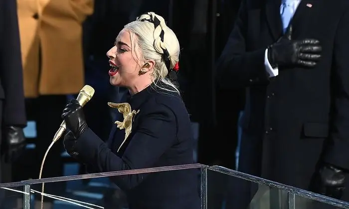 Lady Gaga sings the National Anthem before Joe Biden is sworn in as the 46th US President by Supreme Court Chief Justice John Roberts on January 20, 2021, at the US Capitol in Washington, DC. (Photo by Brendan SMIALOWSKI / AFP)