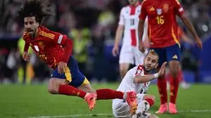 Spain's defender #24 Marc Cucurella collides with Georgia's midfielder #18 Sandro Altunashvili during the UEFA Euro 2024 round of 16 football match between Spain and Georgia at the Cologne Stadium in Cologne on June 30, 2024. (Photo by Kirill KUDRYAVTSEV / AFP)