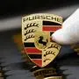 (FILES) This file photo taken on March 4, 2020 shows the logo of German luxury car maker Porsche AG at the company's production site in Stuttgart, southwestern Germany. - The German automotive group Volkswagen is in "advanced discussions" to list the luxury brand Porsche on the stock market, an operation regularly mentioned by analysts to raise funds to finance the electric transition, it said in a press release on February 22, 2022. (Photo by THOMAS KIENZLE / AFP)