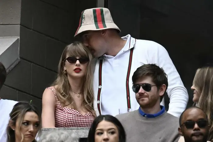 US musician Taylor Swift and US NFL football player Travis Kelce attend the men's final match between Italy's Jannik Sinner and USA's Taylor Fritz on day fourteen of the US Open tennis tournament at the USTA Billie Jean King National Tennis Center in New York City, on September 8, 2024. (Photo by ANGELA WEISS / AFP)