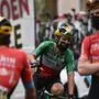 (From L) Team Bahrain's Marco Haller of Austria, Team Bahrain's Sonny Colbrelli of Italy and Team Bahrain's Fred Wright of England wait prior to the 18th stage of the 108th edition of the Tour de France cycling race, 129 km between Pau and Luz Ardiden, on July 15, 2021. (Photo by Anne-Christine POUJOULAT / AFP)