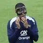 France's Kylian Mbappe gestures as he adjusts his face mask during a training session in Paderborn, Germany, Thursday, June 27, 2024, ahead of their round of 16 soccer match against Belgium at the Euro 2024 soccer tournament. (AP Photo/Hassan Ammar)