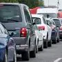 Cars wait in line at the Bratislava-Berg border crossing between Austria and Slovakia during the coronavirus COVID-19 pandemic on June 4, 2020. - Austria has re-opened its borders to all its neighbors except Italy, although the neighboring countries did not reciprocate reopening of frontier crossings, testing the patience of some motorists and other travelers. (Photo by JOE KLAMAR / AFP)
