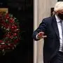 Britain's Prime Minister Boris Johnson, wearing a face covering to stop the spread of coronavirus, leaves from 10 Downing Street in central London on December 8, 2021, to take part in the weekly session of Prime Minister Questions (PMQs) at the House of Commons. - British Prime Minister Boris Johnson faced intense pressure Wednesday after a video emerged of his senior aides joking about holding a Christmas party at Downing Street last year when social gatherings were banned under Covid-19 rules. (Photo by Adrian DENNIS / AFP)