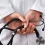 Close-up Photo Of Doctor Hands Holding Stethoscope