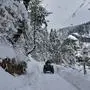 February 23, 2024, Drung, India: A man rides a quad bike along the snow-covered road during a winter day in Drung, about 45kms from Srinagar, the summer capital of Jammu and Kashmir. Drung India - ZUMAs197 20240223_aab_s197_028 Copyright: xSaqibxMajeedx