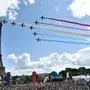 French aerial patrol 'Patrouille de France' fly over the fan village of The Trocadero set in front of The Eiffel Tower, in Paris on August 8, 2021 upon the transmission of the closing ceremony of the Tokyo 2020 Olympic Games. (Photo by STEPHANE DE SAKUTIN / AFP)
