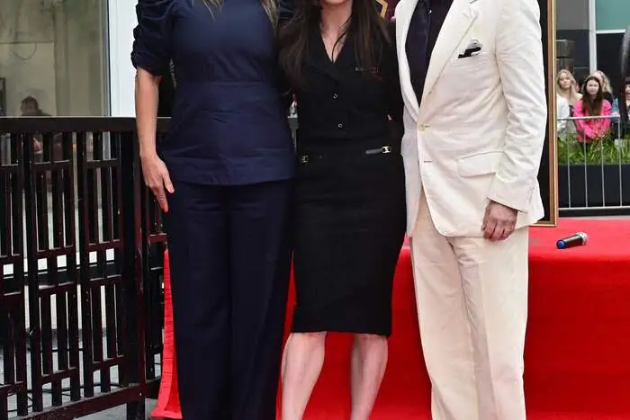 Actress Christina Ricci (C), director Patty Jenkins (L) and actor, producer and writer Dan Bucatinsky stand beside Ricci's just unveiled Hollywood Walk of Fame Star during a  ceremony on March 6, 2025 in Hollywood, California. (Photo by Frederic J. BROWN / AFP)