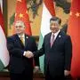 In this picture issued by the Hungarian PM's Press Office, Chinese President Xi Jinping, right, receives Hungarian Prime Minister Viktor Orban before their bilateral meeting in the Great Hall of the People in Beijing, China, Tuesday, Oct. 17, 2023. (Zoltan Fischer/Hungarian PM's Press Office/MTI via AP)