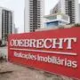 This file photo taken on June 23, 2016 shows a sign of Brazilian construction company Odebrecht at the Olympic and Paralympic Village in Rio de Janeiro, Brazil.
Brazilian construction giant Odebrecht's practice of landing huge public works contracts by paying hundreds of millions of dollars in bribes has caught up with it, and the fallout is spreading across Latin America, where the scandal has left a trail of abandoned mega-projects, high-profile probes and outraged citizens in its wake.
 / AFP PHOTO / YASUYOSHI CHIBA / TO GO WITH AFP STORY BY TUPAC POINTU - XGTY