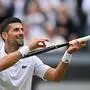 Serbia's Novak Djokovic imitates playing the violin with his racquet as he celebrates winning against Italy's Lorenzo Musetti during their men's singles semi-final tennis match on the twelfth day of the 2024 Wimbledon Championships at The All England Lawn Tennis and Croquet Club in Wimbledon, southwest London, on July 12, 2024. Djokovic won the match 6-4, 7-6, 6-4. (Photo by ANDREJ ISAKOVIC / AFP) / RESTRICTED TO EDITORIAL USE