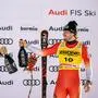 First placed Switzerland's Alexis Monney (R) celebrates with second placed Switzerland's Franjo von Allmen during the podium ceremony of the Men's Downhill race as part of the FIS Alpine ski World Cup 2024-2025, in Bormio, Italy, on December 28, 2024. (Photo by Fabrice COFFRINI / AFP)