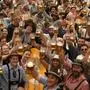 Festival enjoy the first glasses of beer on day one of the 189th 'Oktoberfest' beer festival in Munich, Germany, Saturday, Sept. 21, 2024. (AP Photo/Matthias Schrader)