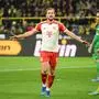 Bayern Munich's English forward #09 Harry Kane (L) celebrates scoring the 0-4 goal  next to Dortmund's German defender #25 Niklas Suele during the German first division Bundesliga football match between BVB Borussia Dortmund and FC Bayern Munich in Dortmund, western Germany on November 4, 2023. (Photo by INA FASSBENDER / AFP) / DFL REGULATIONS PROHIBIT ANY USE OF PHOTOGRAPHS AS IMAGE SEQUENCES AND/OR QUASI-VIDEO