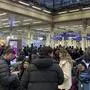 Passengers wait on the concourse at the entrance to Eurostar in St Pancras International station, central London, after high-speed services between London and Ebbsfleet were cancelled because of flooding in a tunnel under the Thames, on Saturday Dec. 30, 2023. (Lucas Cumiskey/PA via AP)