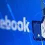 (FILES) In this file photo taken on May 16, 2018 shows the logo of the social network Facebook on a broken screen of a mobile phone. - Facebook said Thursday, November 15, 2018 it was severing ties with a political consultancy that sought to discredit critics of the social networking giant using questionable campaign-style tactics. The California-based company's announcement followed a lengthy New York Times investigation detailing Facebook's struggles with its image as it came under scrutiny for its handling of Russian-led misinformation efforts. Facebook said in a statement that "we ended our contract" with Definers Public Affairs, which specializes in opposition research and, according to the Times, sought to link anti-Facebook efforts to financier George Soros. But Facebook disputed claims that it used the firm in a nefarious way. (Photo by JOEL SAGET / AFP)