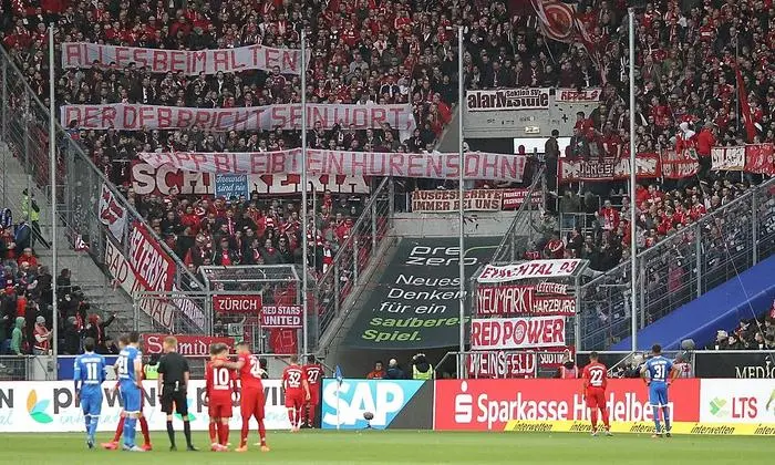 Hoffenheim's supporters deploy banners reading 