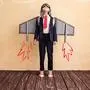Portrait of young businessman with toy paper wings. Success, creative and startup concept. Copy space for your text