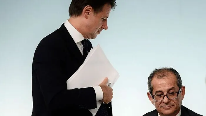 Italy's Prime Minister, Giuseppe Conte (L) and Italy's Minister of Economy and Finances, Giovanni Tria