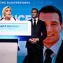 TOPSHOT - French far-right Rassemblement National (RN) party leader Marine Le Pen (L) addresses militants as party President Jordan Bardella listens after French President announced he is calling for new general elections on June 30, during an evening gathering on the final day of the European Parliament election, at the Pavillon Chesnaie du Roy in Paris, on June 9, 2024. (Photo by JULIEN DE ROSA / AFP)