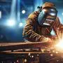 welder is welding metal , industry them bokeh and sparkle background