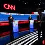 Former US President and Republican presidential candidate Donald Trump (L) takes a drink of water next to US President Joe Biden as the press exits the debate stage during the first presidential debate of the 2024 elections at CNN's studios in Atlanta, Georgia, on June 27, 2024. (Photo by CHRISTIAN MONTERROSA / AFP)