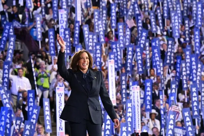 (FILES) US Vice President and 2024 Democratic presidential candidate Kamala Harris waves as she arrives to speak on the fourth and last day of the Democratic National Convention (DNC) at the United Center in Chicago, Illinois, on August 22, 2024. Kamala Harris and Donald Trump are entering the final one-month sprint to the most dramatic US presidential election in modern history, with both candidates warning the fate of a divided nation hangs on a result that is still too close to call. (Photo by Robyn Beck / AFP)