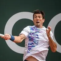 Austria's Sebastian Ofner returns the ball to Norway's Casper Ruud during their ATP 250 Geneva Open tennis tournament single match, in Geneva, on May 22, 2024. (Photo by Fabrice COFFRINI / AFP)