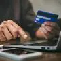 Businessman holding credit card and typing on laptop for online shopping and payment makes a purchase on the Internet, Online payment, Business financial and technology.
