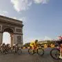 Slovenia's Tadej Pogacar, wearing the overall leader's yellow jersey, rides past the Arc de Triomphe on the Champs-Elysees during the twenty-first and last stage of the Tour de France cycling race over 122 kilometers (75.8 miles), from Mantes-la-Jolie to Paris, France, Sunday, Sept. 20, 2020. (AP Photo/Christophe Ena)