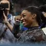 US' Simone Biles reacts after competing in the uneven bars event of the artistic gymnastics women's qualification during the Paris 2024 Olympic Games at the Bercy Arena in Paris, on July 28, 2024. (Photo by Paul ELLIS / AFP)