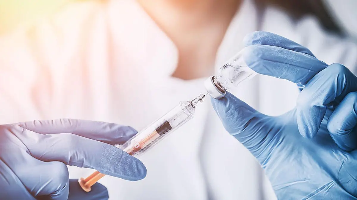 injecting injection vaccine vaccination medicine flu man doctor insulin health drug influenza concept - stock image